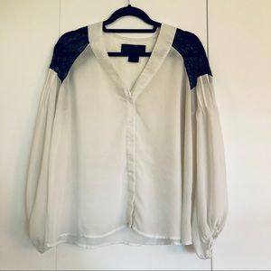 Sheer white blouse with black lace shoulders
